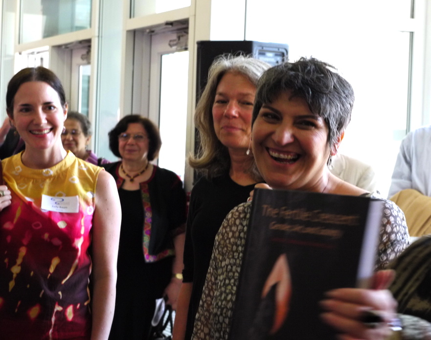 Artist Parastou Forouhar holding the catalog of the exhibition 02