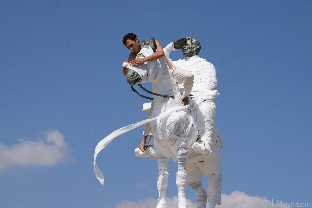 After The Watchman 2018, performer Ram Atkin Matzliach dresses the sculpture of Alexander Zaïd, in Sheikh Abreik/ Bet Shearim, Jezreel Valley, photo Gal Mosenson ariane_littman_after_the_watchman_01
