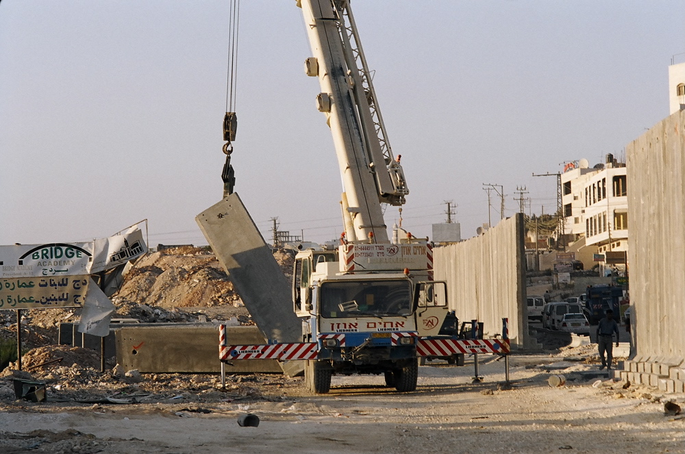 Crane pulling up a concrete barrier in A'Ram in September 2004 Ar Ram, Sept. 04, 04