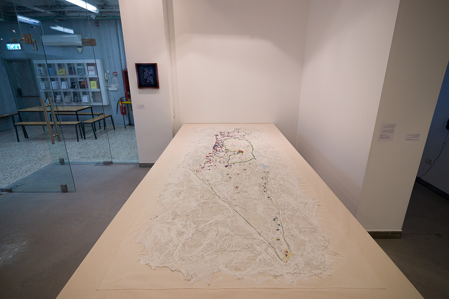 Wounded Land (2020-2021) detail, based on The Holy Land «Road Map of Israel-Palestine 1:150 000» printed by Freytag and Berndt (2016), The Corona “Traffic Light Map” of the National Emergency Portal (2020-21), The Black Flag Protest Map (2020-21), & The 'National Emergency Portal' (oref.org.il) of rocket and missile attacks on Israel & as riots in mixed cities, May 2021. Map, gauzes bandages, plaster, ink, thread and fabric
340 x 170 cm
Photo: Udi Katzman Ariane_Sadnaot_010