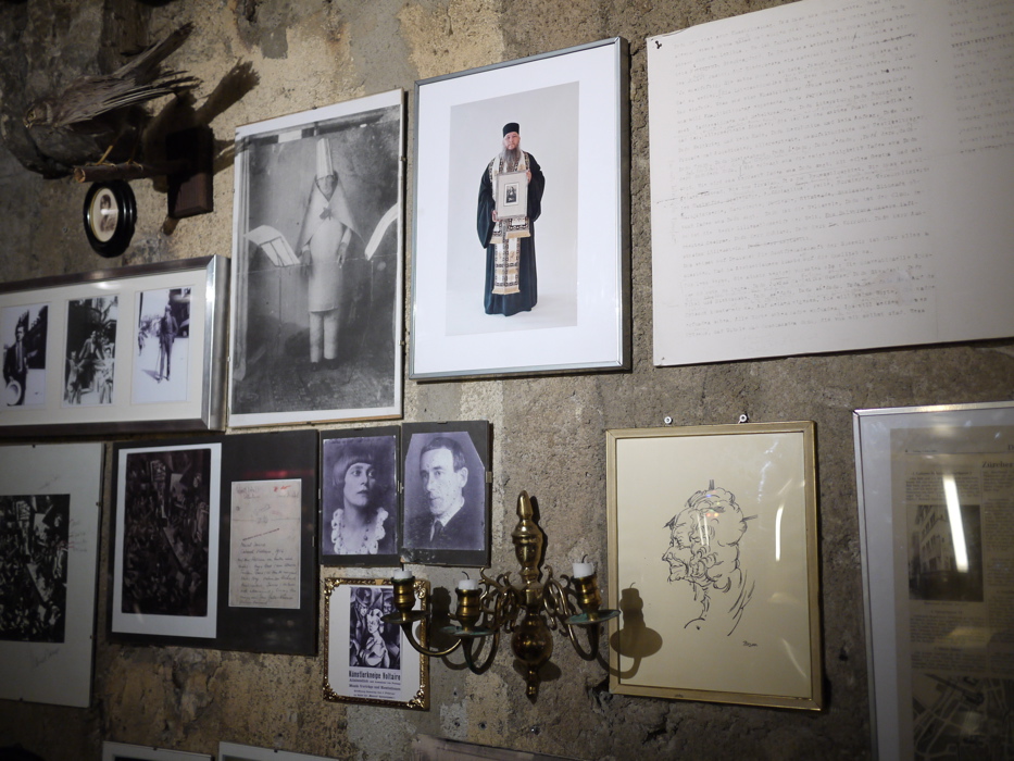 Wall in the Cabaret Voltaire, showing among other thing, Hugo Ball wearing his a cubist costume while declaiming his phonic poem ‘Elefantenkarawane’ at the Cabaret Voltaire in June 1916. Dada-Jerusalem 008
