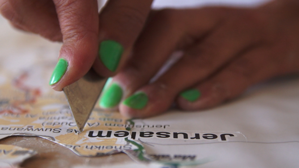 Cutting the Jerusalem Closures' Maps, still from the video DADA-JERUSALEM Dada-Jerusalem 035