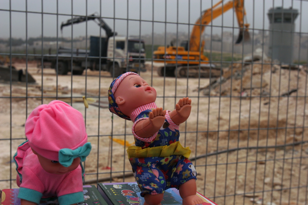 Dolls at the Kalandiya checkpoint, in the background the wall being erected, February 2006 Dolls at Kalandia checkpoint Feb 09 06 03 jpg
