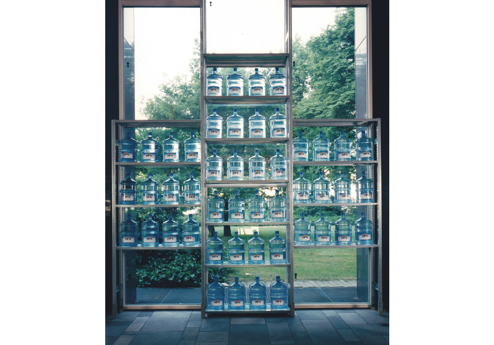 Holy Waters (1998), installation in the shape of a cross of 55 mineral water containers, 20 L (each) on industrial shelves Holy Waters 001