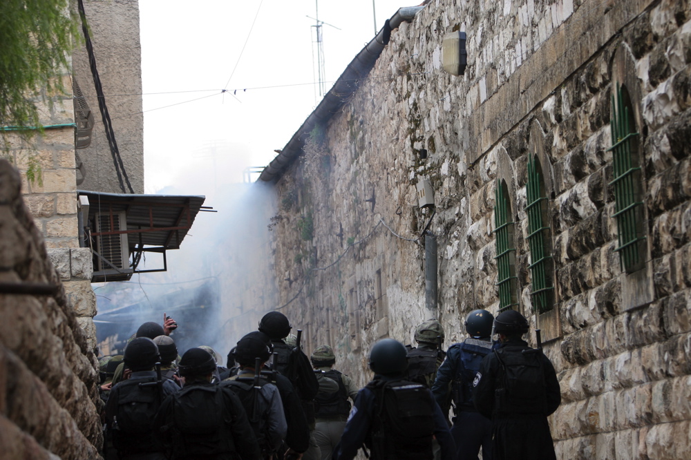 Soldier throwing a stun grenade during violent riots in East Jerusalem, February 2007 Soldier throwing a stun grenade, Feb 9 07 10