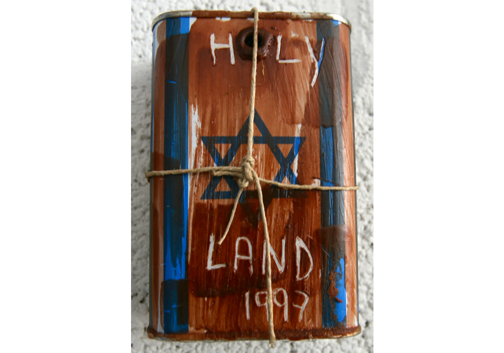 Five Rectified Blue Boxes, (1997), tin, wax and linen string, 14 x 9.5 x 5 (each),
boxes: courtesy of the Jewish National Fund
The Blue Box 00