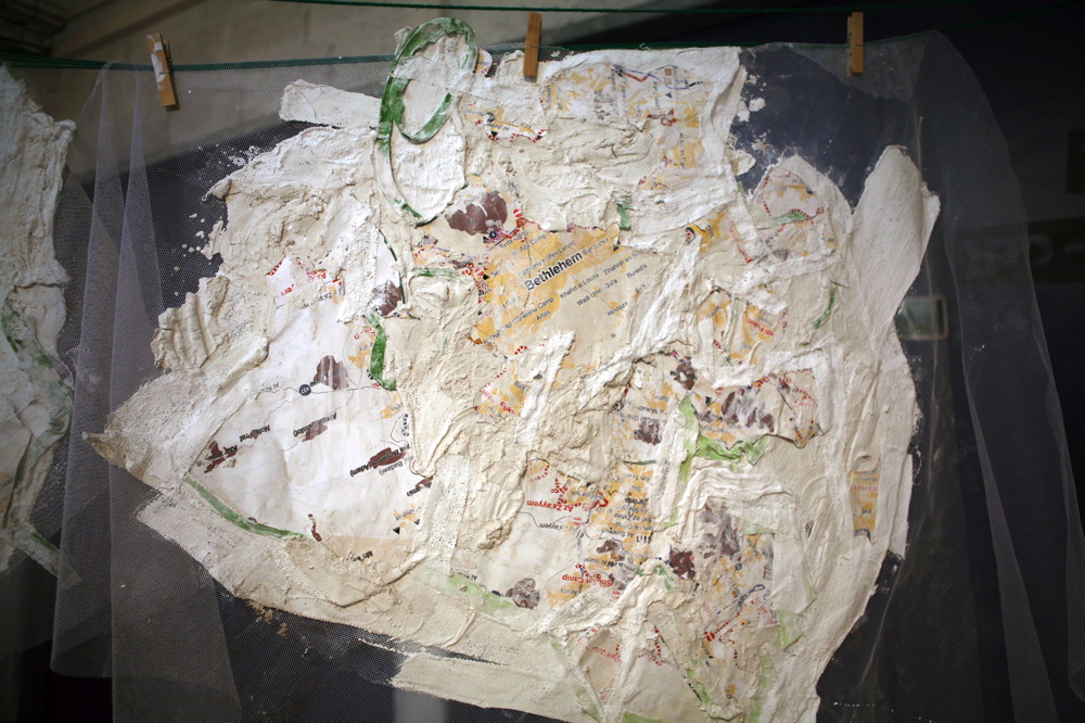 'Operated Closure Maps' (2005), maps of Jerusalem, plaster, glue, cement, green thread and ribbon, variable dimension
Wounded Landscape 005